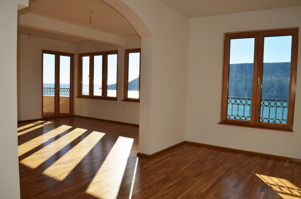 Bright living room with parquet flooring and panoramic sea view in a residential complex, Igalo, Herceg Novi, Montenegro.