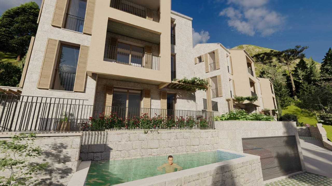 Modern villa with a pool and stone facade in Kamenovo, Montenegro: view of a residential complex with terraces.