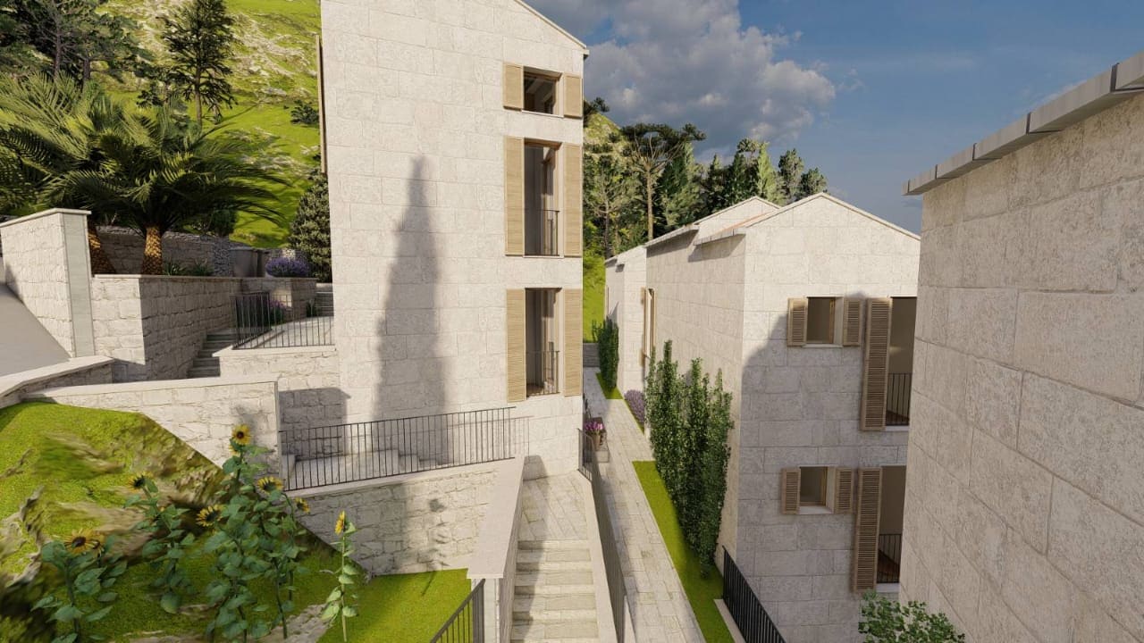 Modern light-stone villa in Kamenovo, Montenegro: exterior with terraces, staircases, and landscaping.