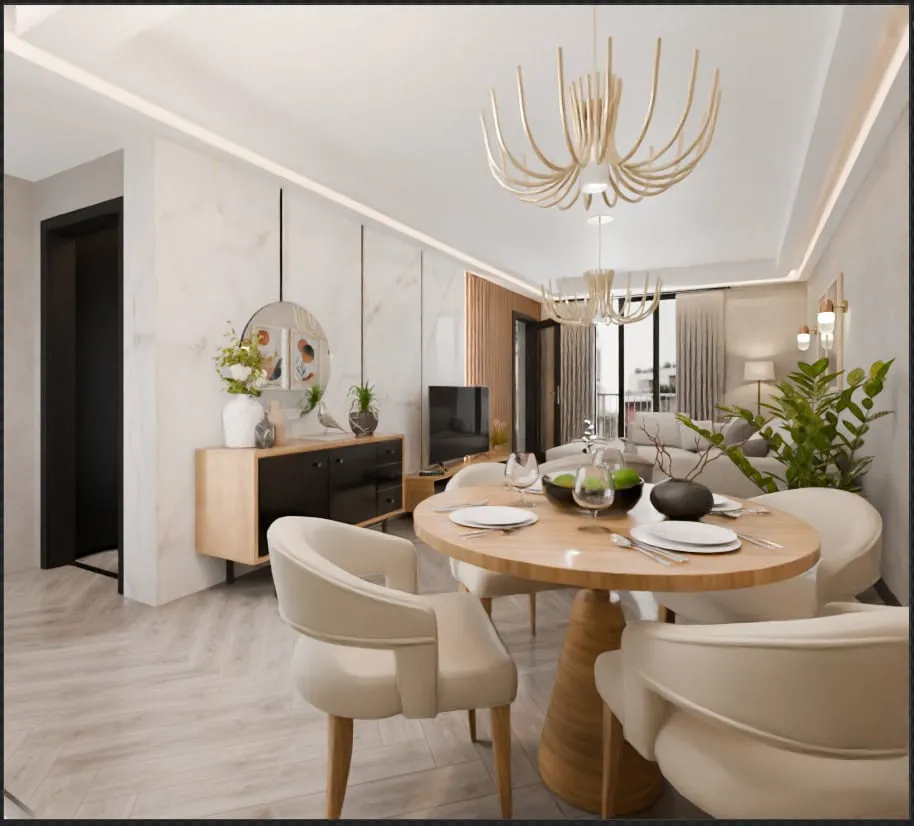Modern living and dining area featuring a round wooden table, cream chairs, sofa, and TV on marble wall.