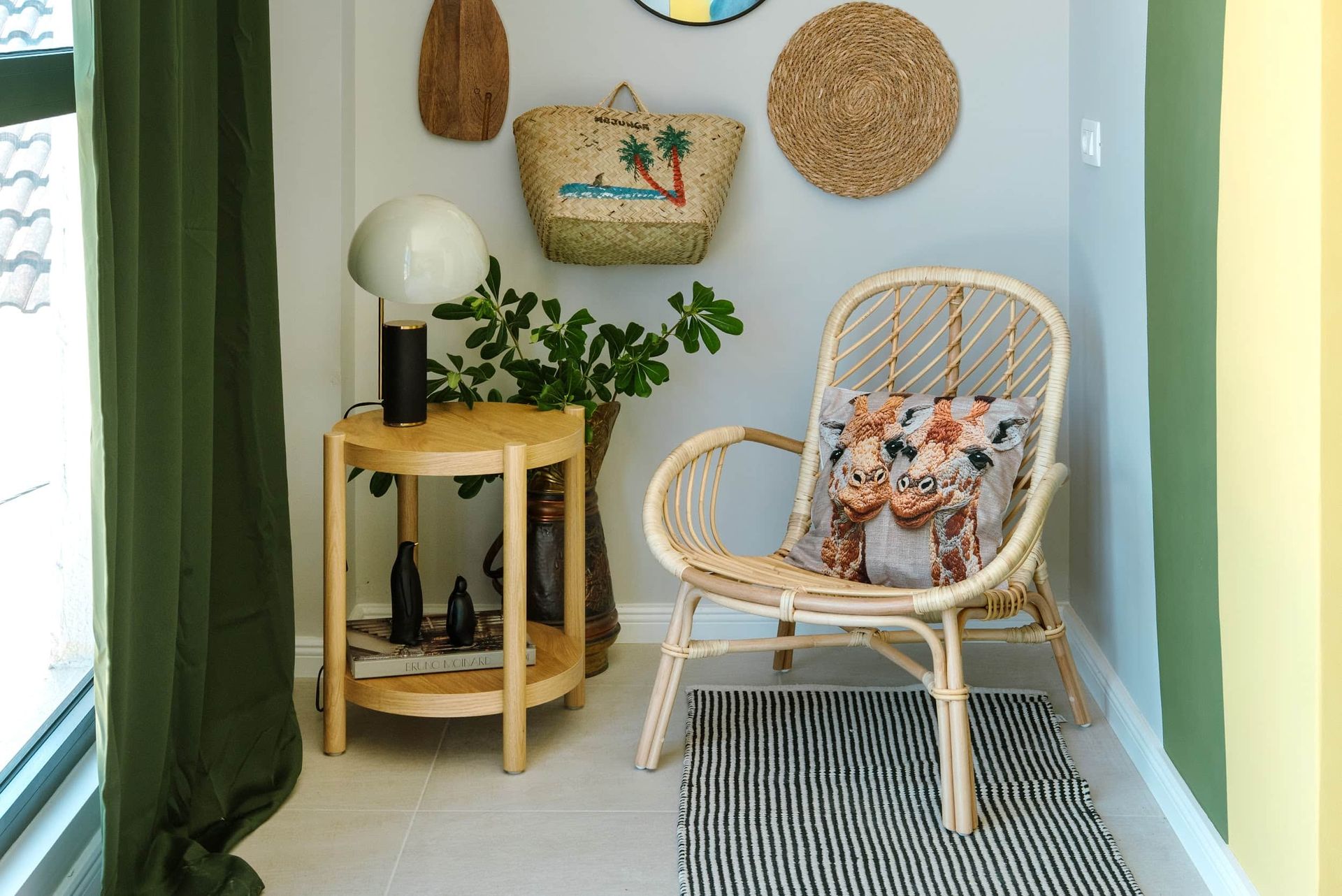Cozy lounge area in a villa living room in Krašići, Montenegro: rattan armchair, wooden coffee table, and boho-style decor.