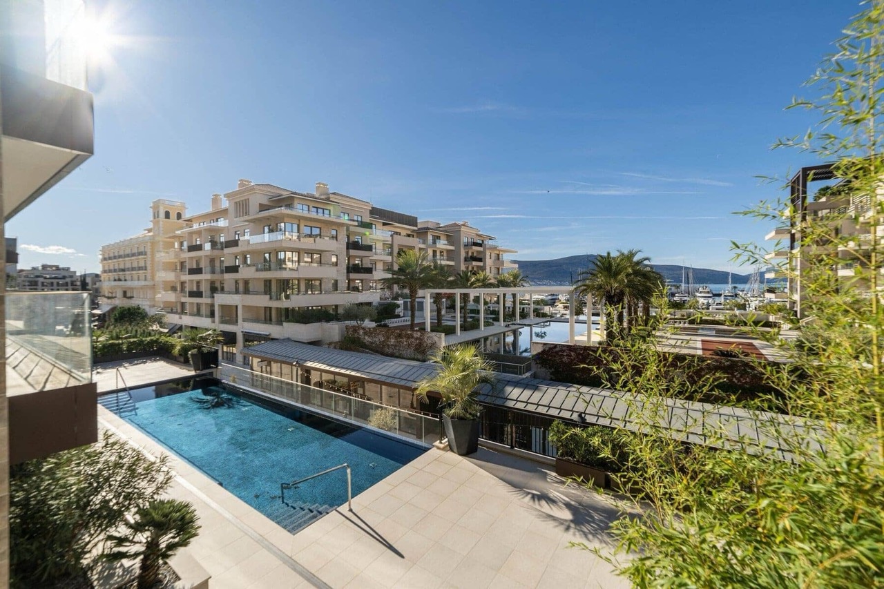 View of the outdoor pool and luxury residential complex in Porto Montenegro, Tivat, Montenegro from the apartment terrace.
