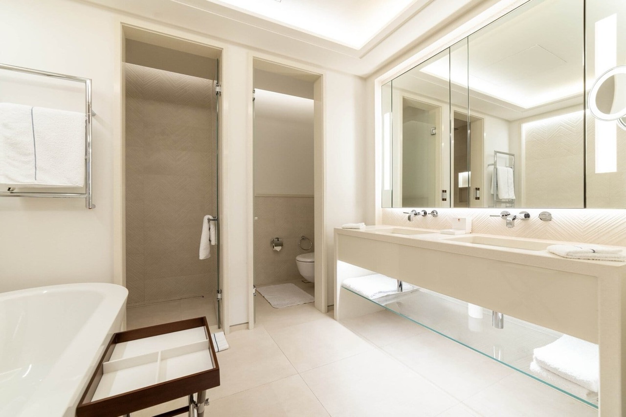 Modern bathroom with a shower and double sink in a luxury apartment in Porto Montenegro, Tivat, Montenegro.