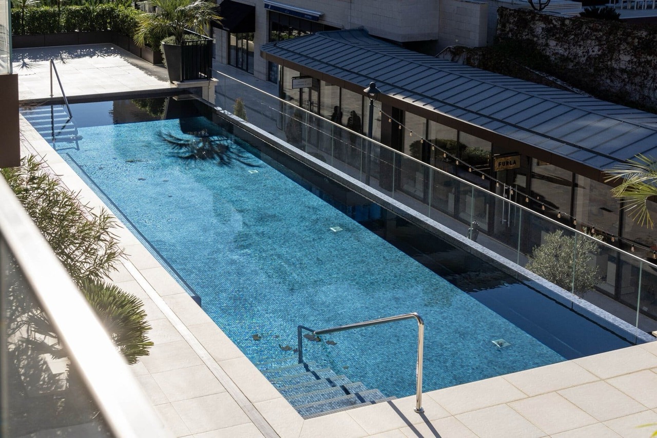Open infinity pool with blue tiles in the luxury Porto Montenegro complex, Tivat, Montenegro.