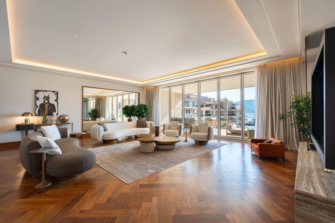 Spacious living room with designer furniture and panoramic sea views in the upscale Porto Montenegro residential complex, Tivat, Montenegro