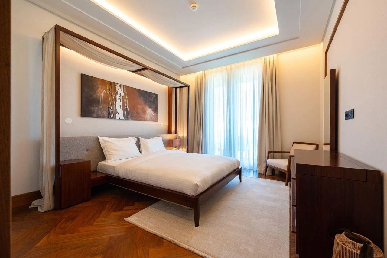 Modern bedroom with a canopy bed in Porto Montenegro apartments, Tivat, Montenegro.