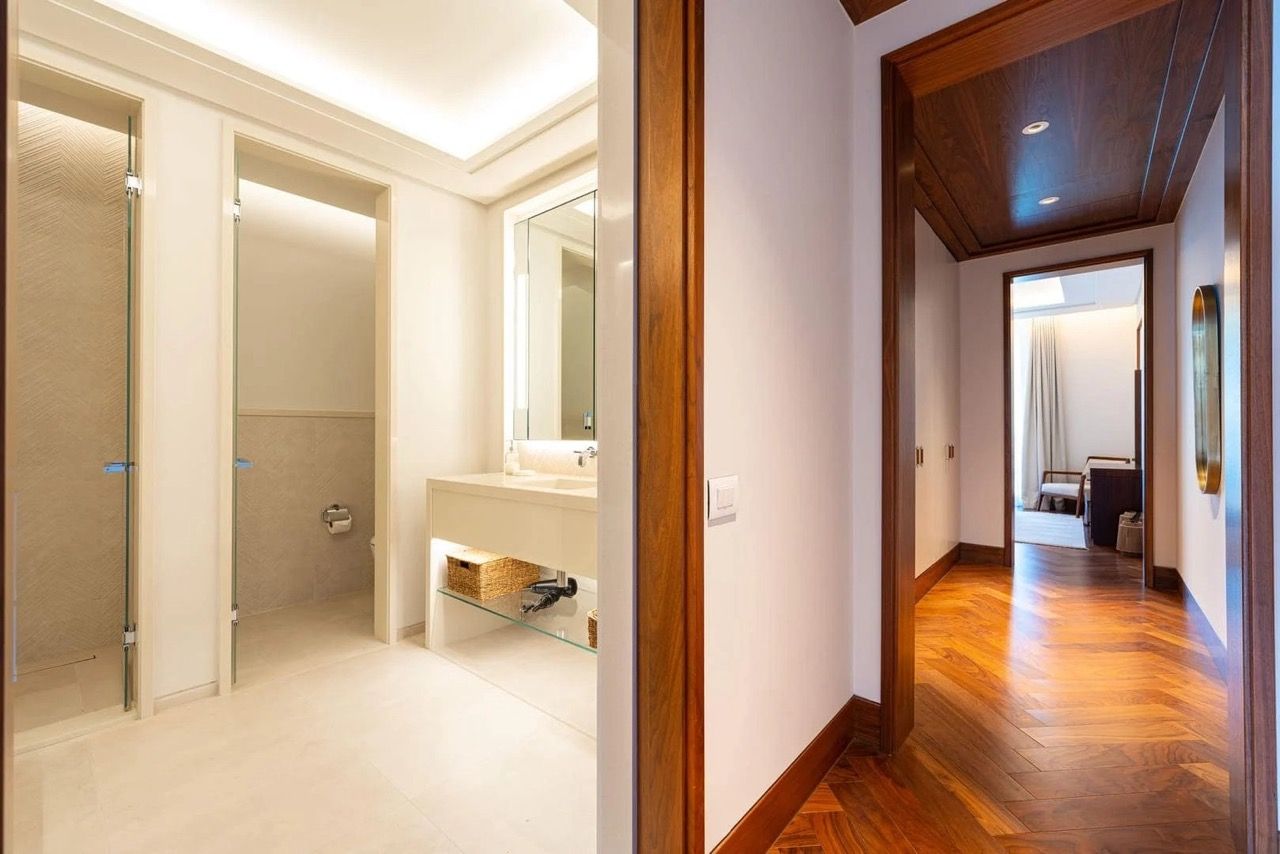 Modern bathroom and hallway with wood finishes in a luxury apartment, Porto Montenegro, Tivat, Montenegro.