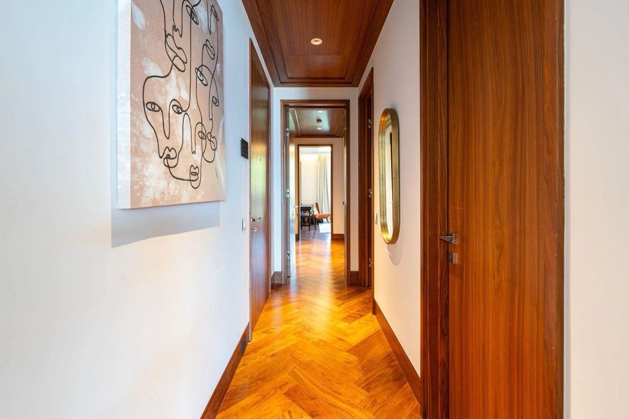 Hallway with herringbone parquet flooring and wood finishes in a luxury apartment, Porto Montenegro, Tivat, Montenegro.
