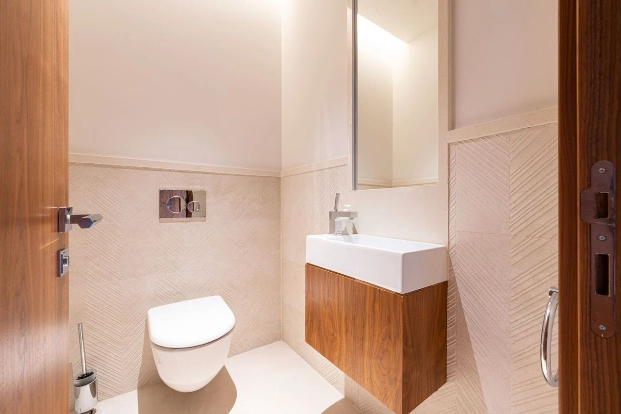 Modern bathroom in an apartment in Porto Montenegro, Tivat, Montenegro: wall-mounted fixtures and tiled finishes.