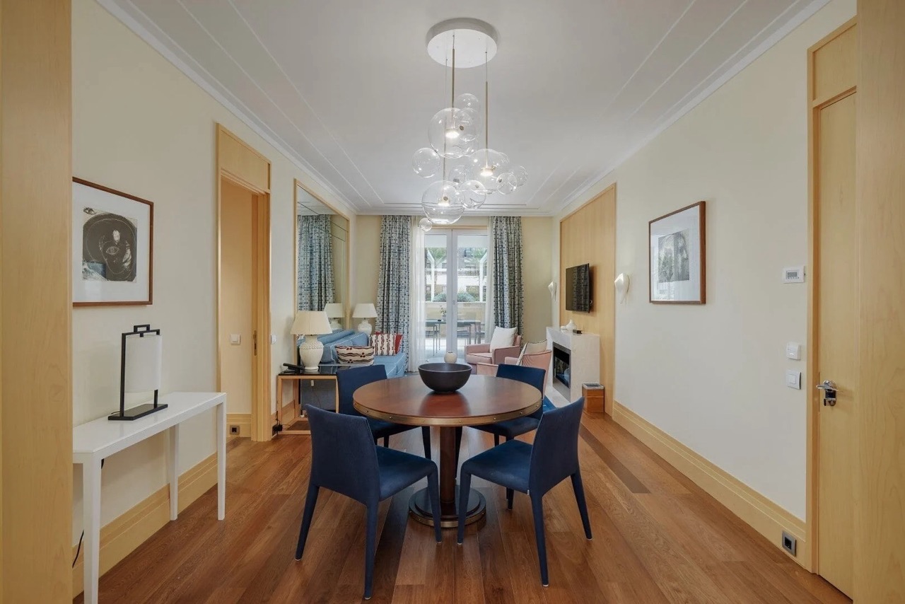 Modern living room with dining area in an apartment in Porto Montenegro, Tivat, Montenegro: wooden floor and stylish decor.