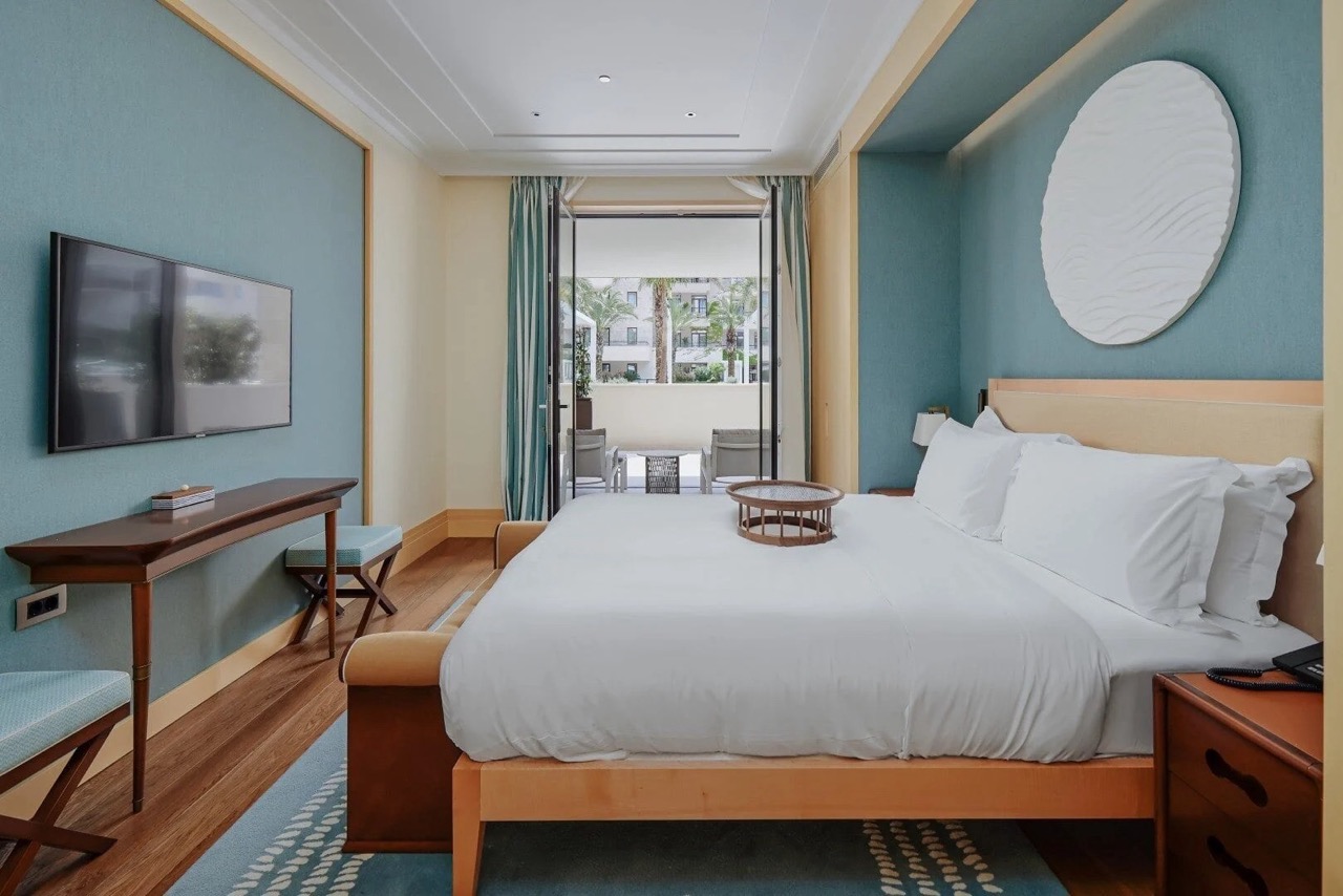 Modern bedroom in Porto Montenegro apartments, Tivat, Montenegro: double bed, terrace, and stylish decor.
