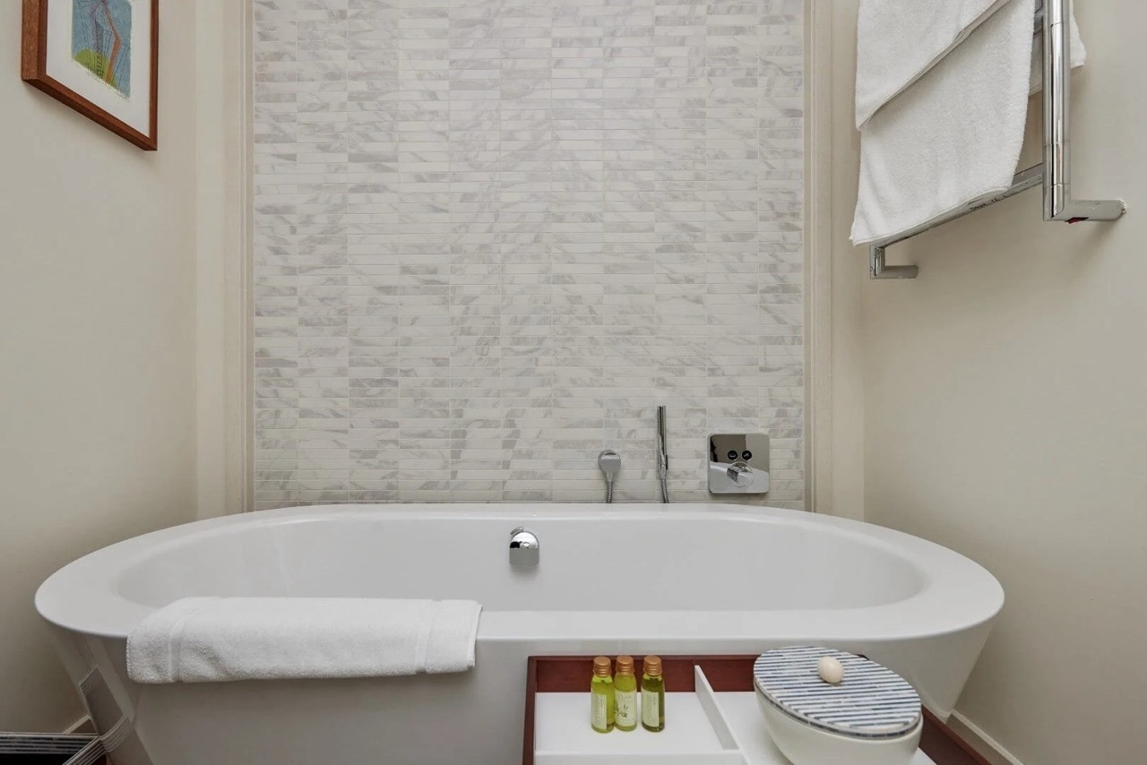 Modern bathroom with a white bathtub in Porto Montenegro apartments, Tivat, Montenegro.