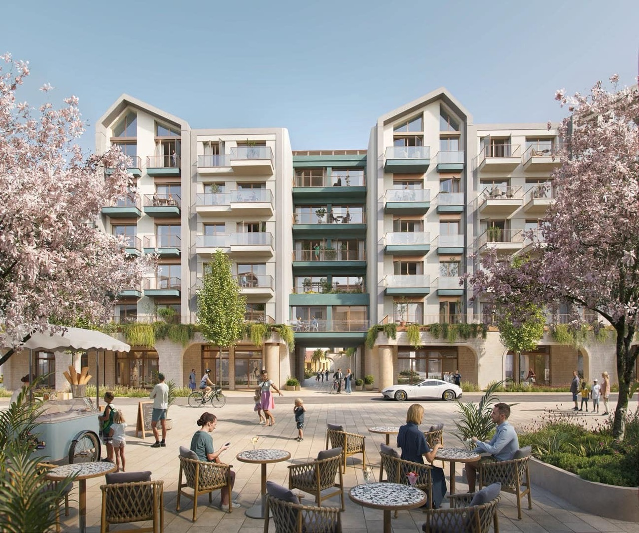 Modern residential complex in Porto Montenegro, Tivat, Montenegro: view of a landscaped square with cafés and terraces.