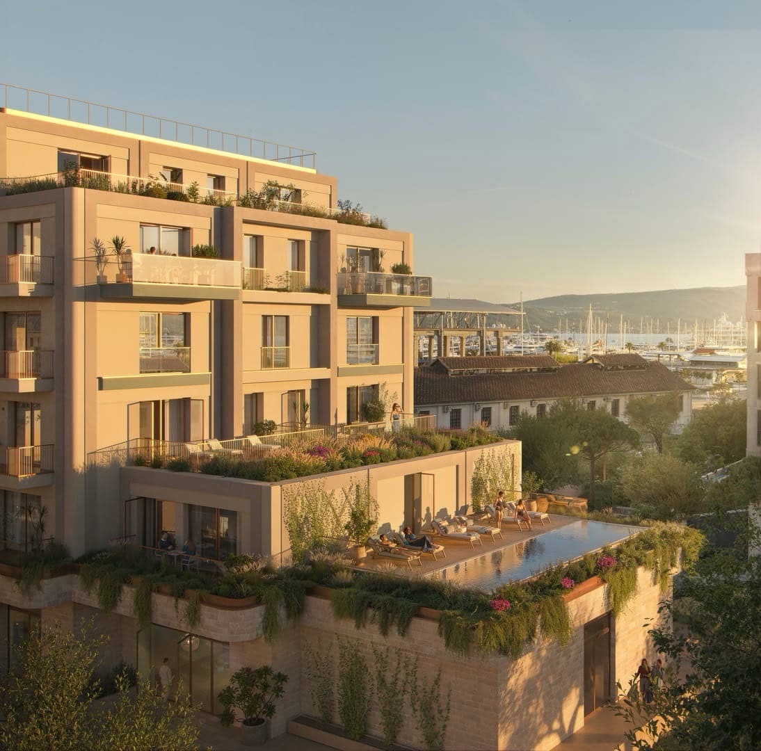 Modern residential complex in Porto Montenegro, Tivat, with terraces, a swimming pool, and marina views in Montenegro.