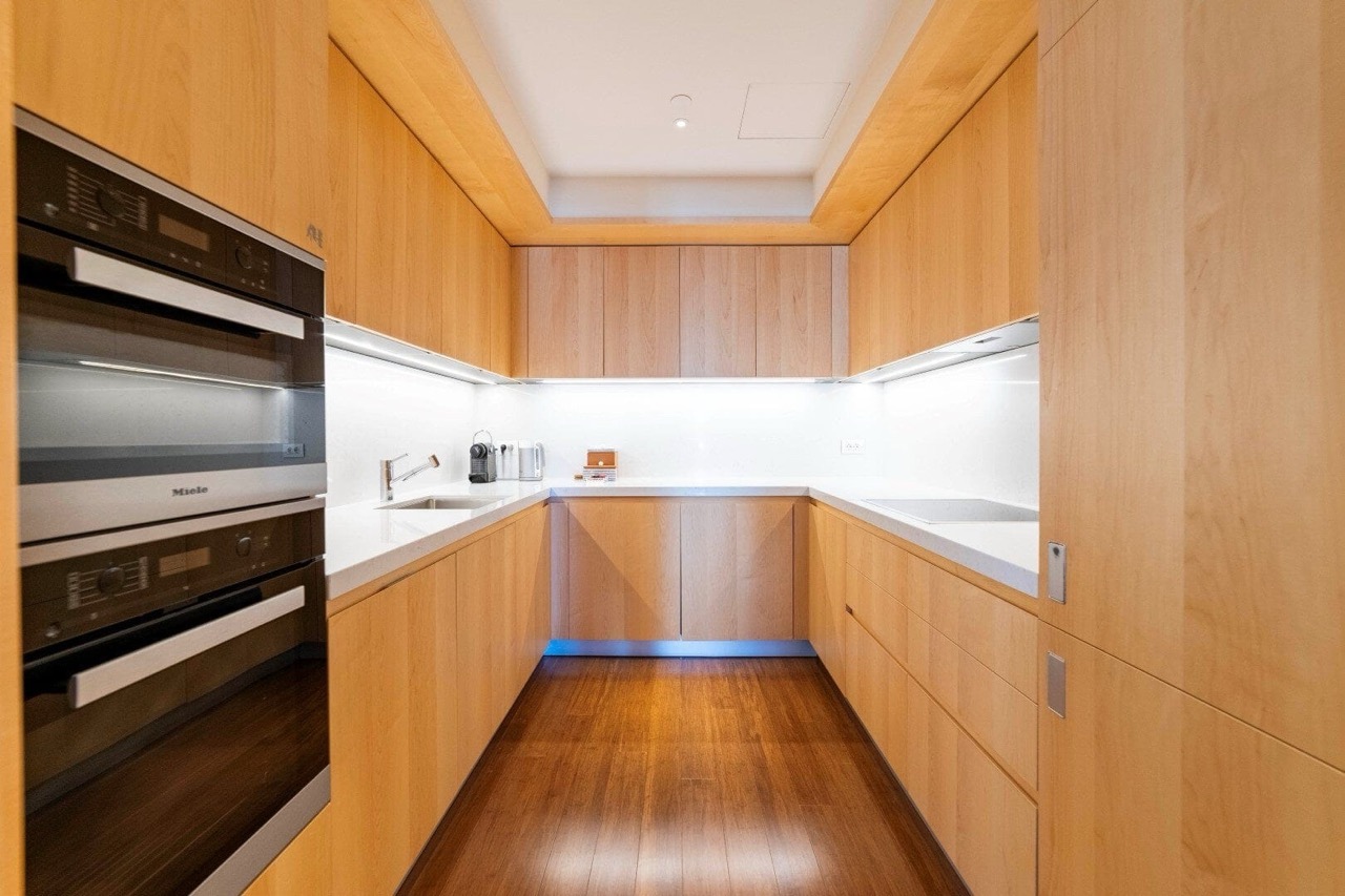 Modern kitchen with wooden fronts and Miele appliances in the Porto Montenegro apartments, Tivat, Montenegro.