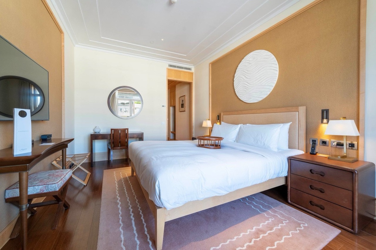 Cozy bedroom with a double bed in an apartment in Porto Montenegro, Tivat, Montenegro: stylish interior and decor.