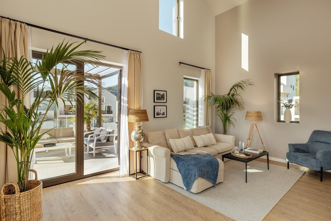 Bright living room with high ceilings and a terrace in an apartment in Porto Montenegro, Tivat, Montenegro.
