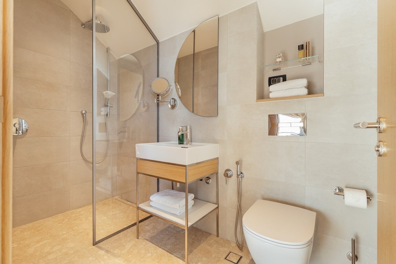 Modern bathroom in an apartment in Porto Montenegro, Tivat, Montenegro: shower cabin, stylish fixtures.