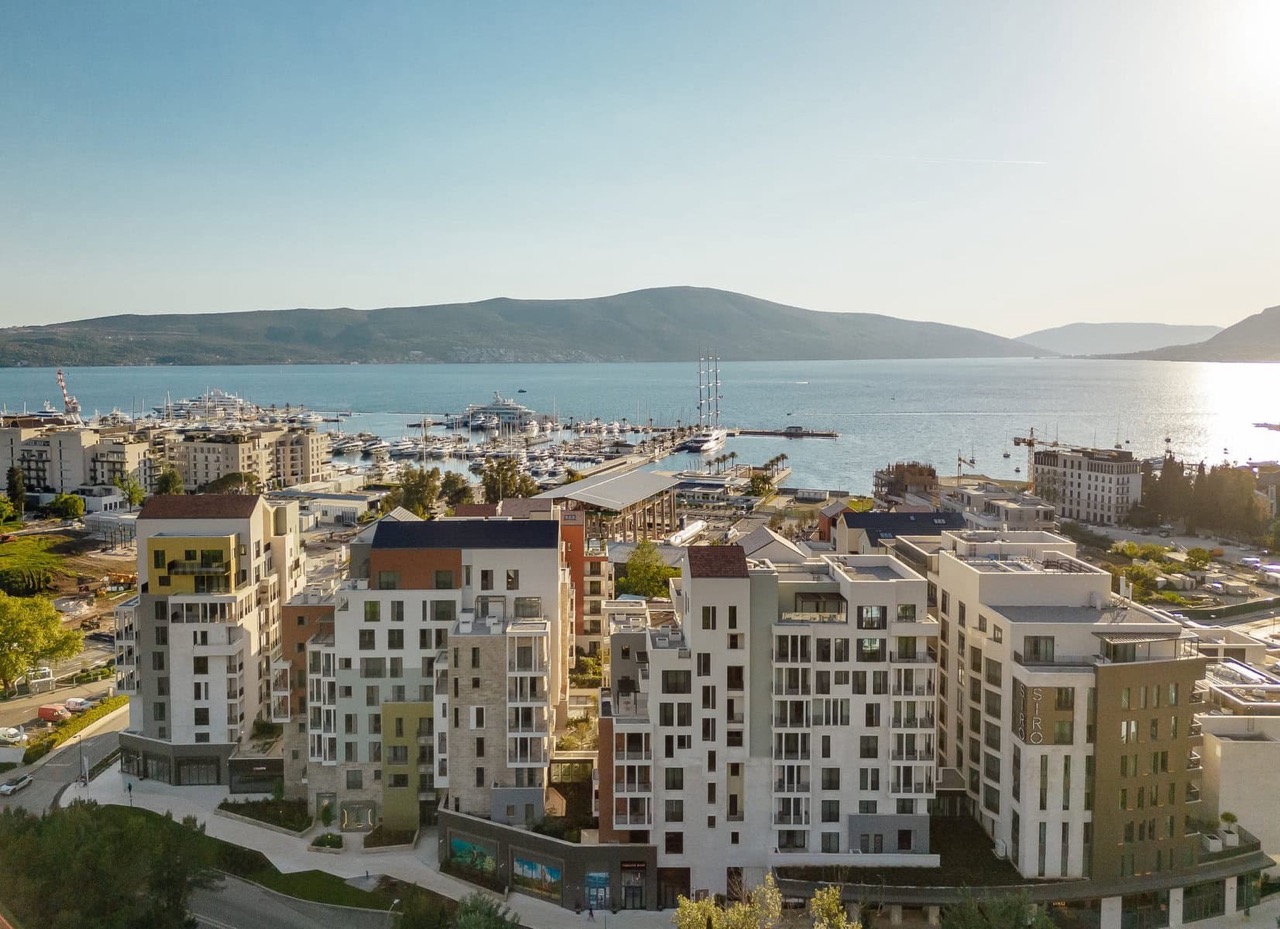 Aerial view of modern residential complexes and Porto Montenegro marina in Tivat, Montenegro.