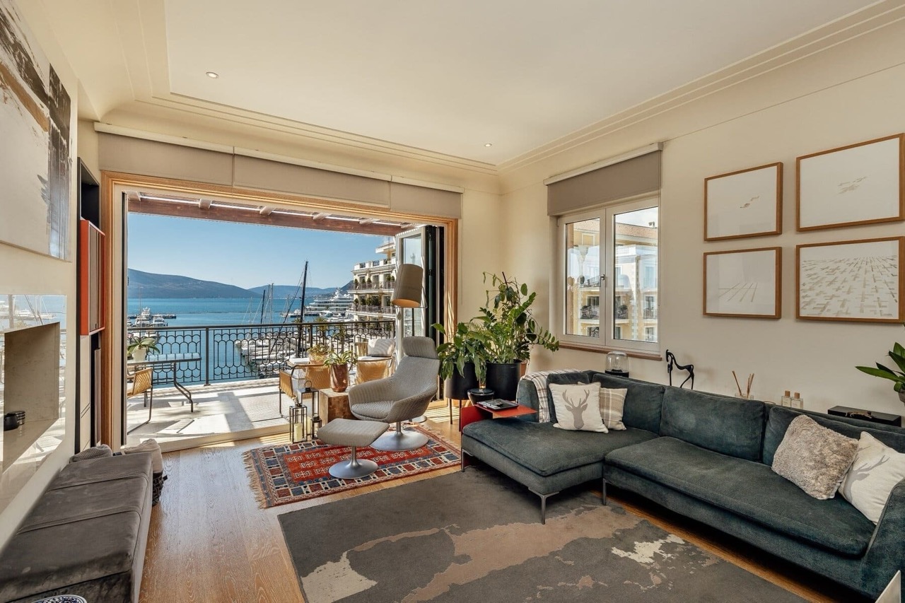 Living room with a view of the marina in Porto Montenegro, Tivat: stylish furniture, a terrace, and panoramic sea views in Montenegro.