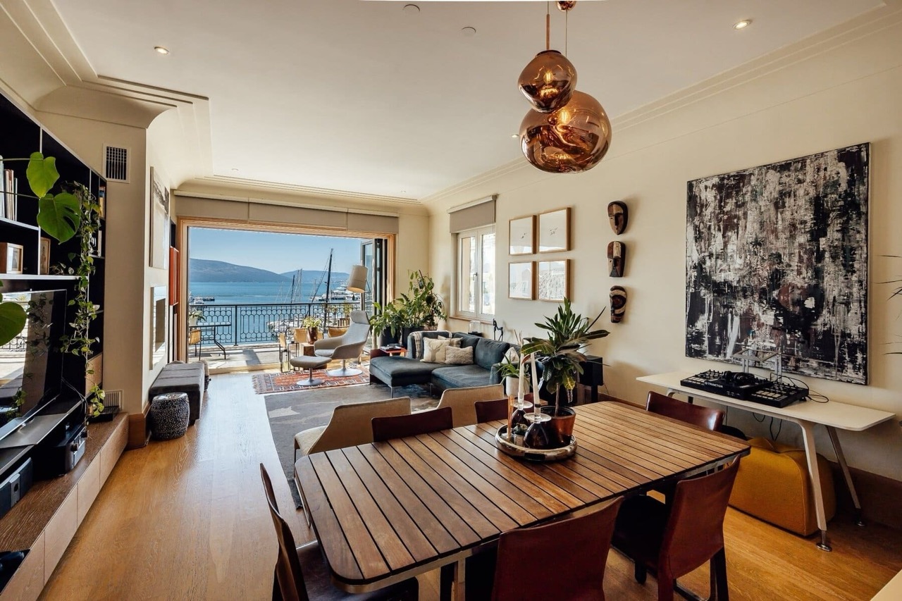 Living room with a view of the marina in a luxury apartment in Porto Montenegro, Tivat, Montenegro: stylish interior and terrace.