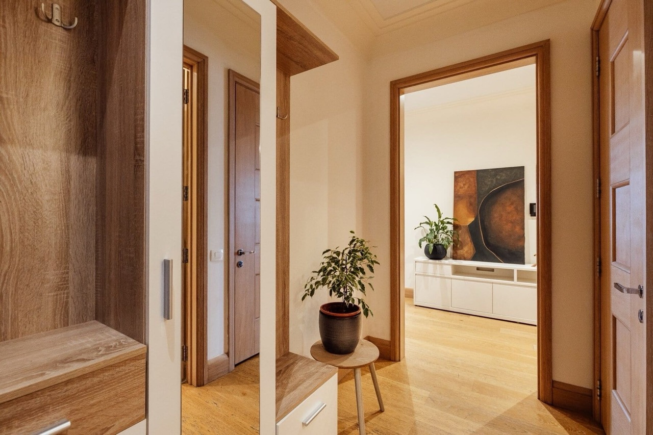 Modern hallway with a mirrored wardrobe and wood finishes in an apartment, Porto Montenegro, Tivat, Montenegro.