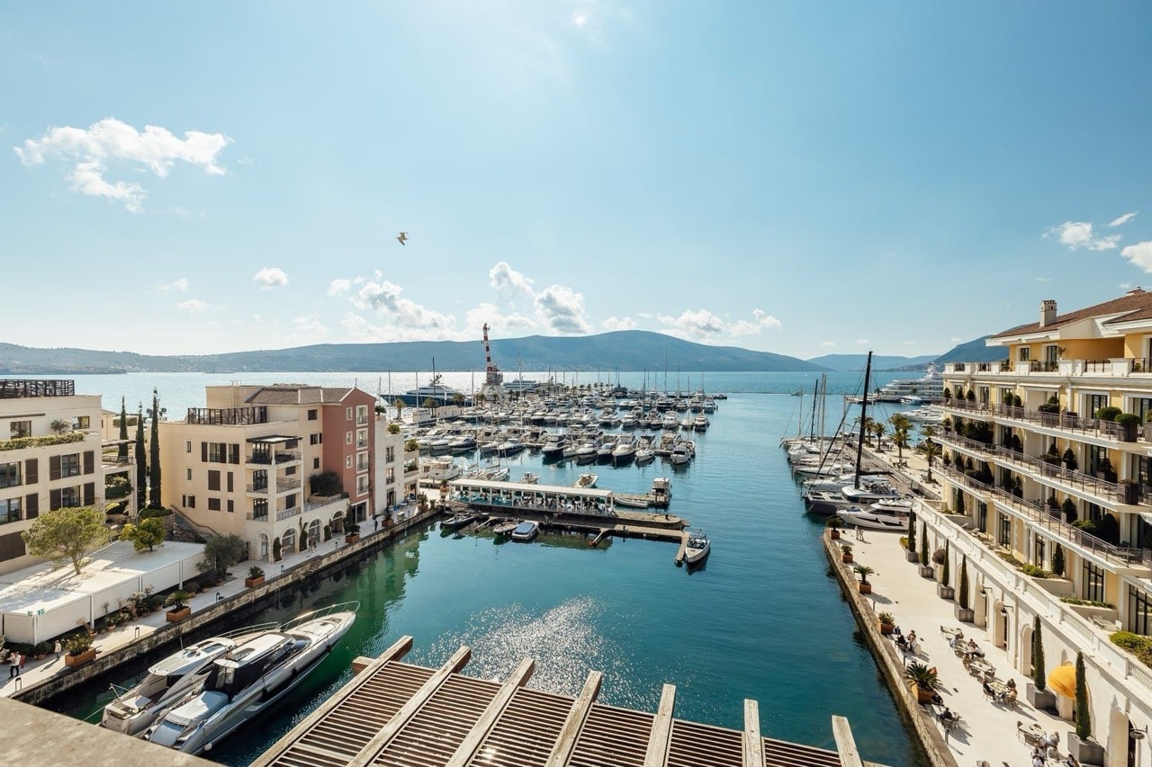 View from the terrace of the marina and yachts in Porto Montenegro, Tivat, Montenegro: luxury seaside property.