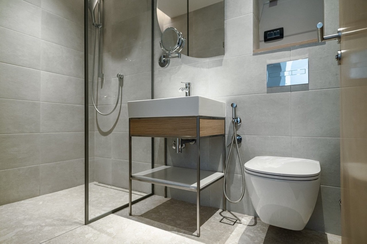 Modern bathroom in an apartment in Porto Montenegro, Tivat, Montenegro: shower cabin, stylish vanity, and sanitary ware.