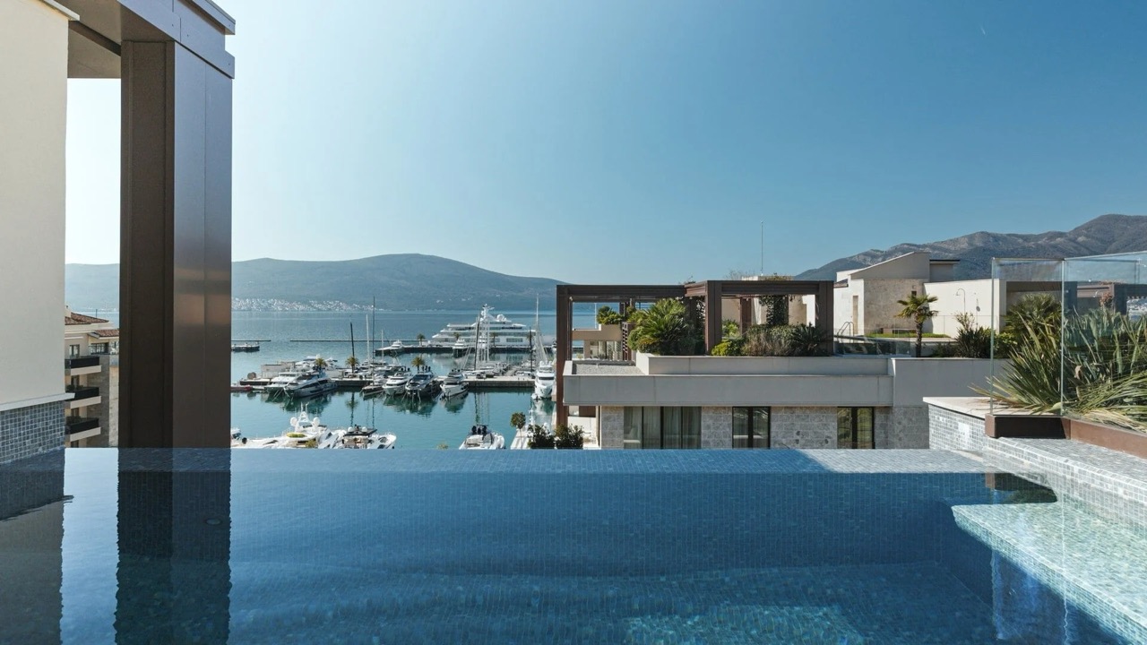 Infinity pool overlooking Porto Montenegro yacht marina, Tivat, Montenegro. Luxury seaside property.