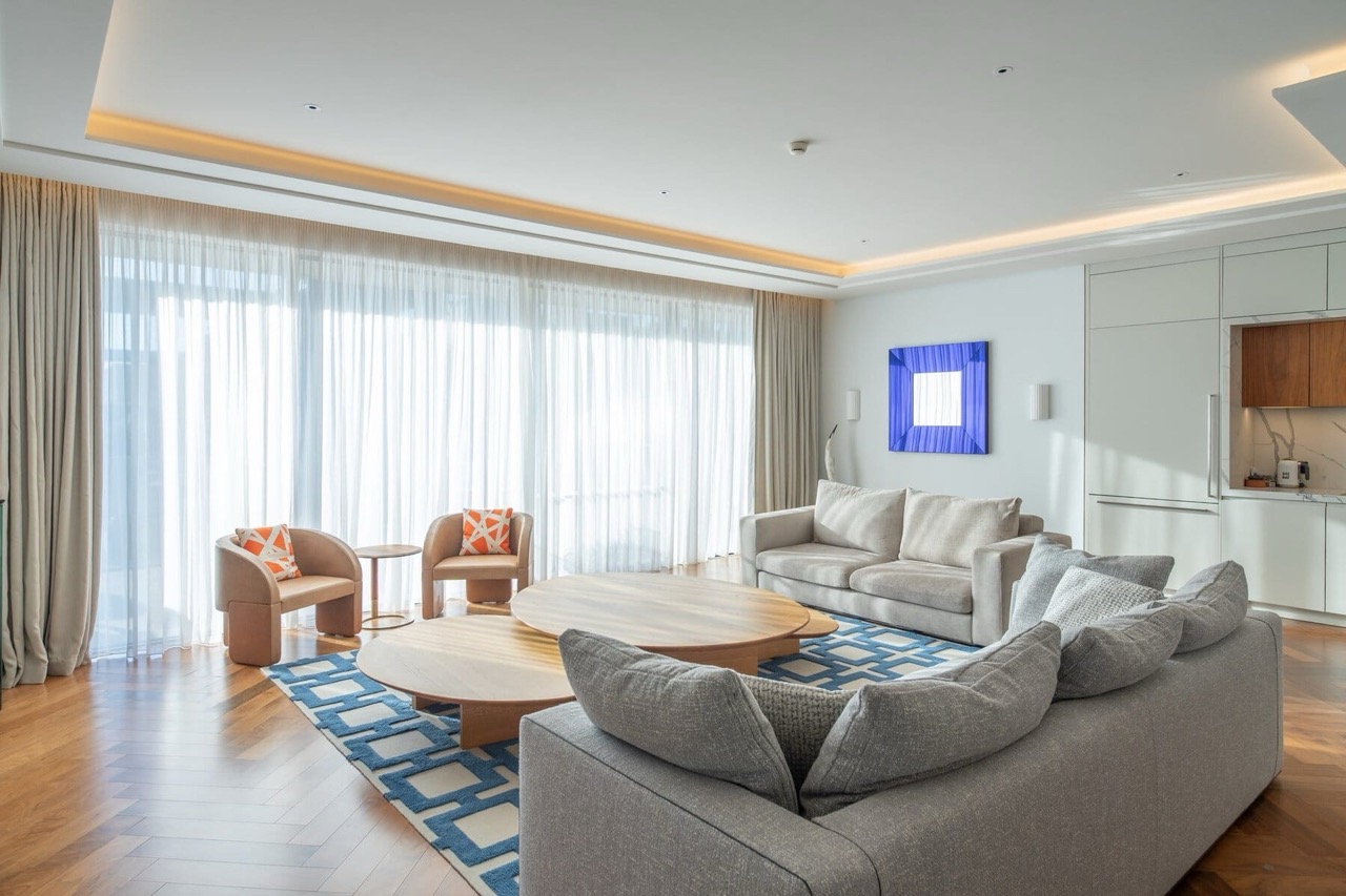 Modern living room with panoramic windows in a luxury apartment in Porto Montenegro, Tivat, Montenegro.