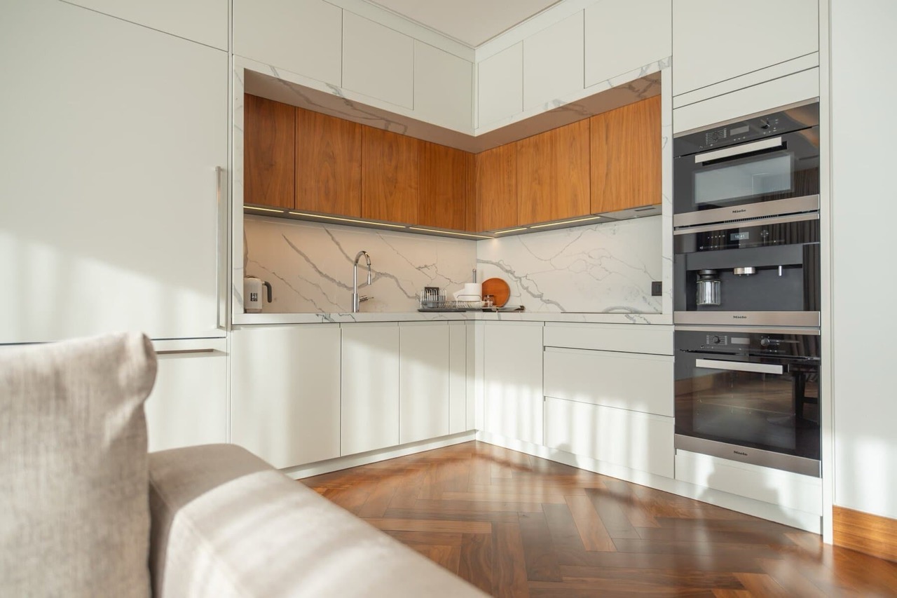 Modern kitchen with marble backsplash and Miele appliances in an apartment, Porto Montenegro, Tivat, Montenegro.