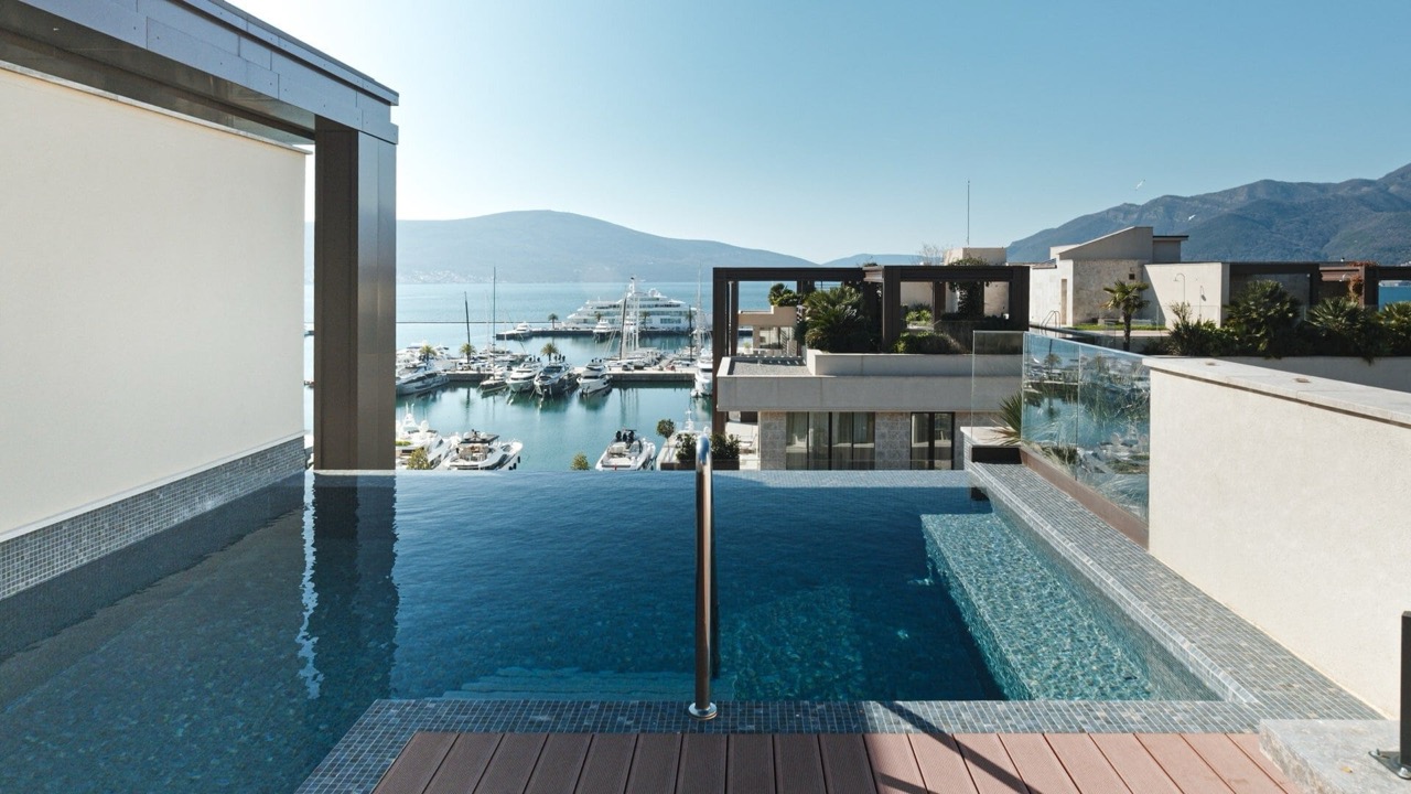 Infinity pool on the terrace of a luxury apartment in Porto Montenegro, Tivat, Montenegro, overlooking the yacht marina.