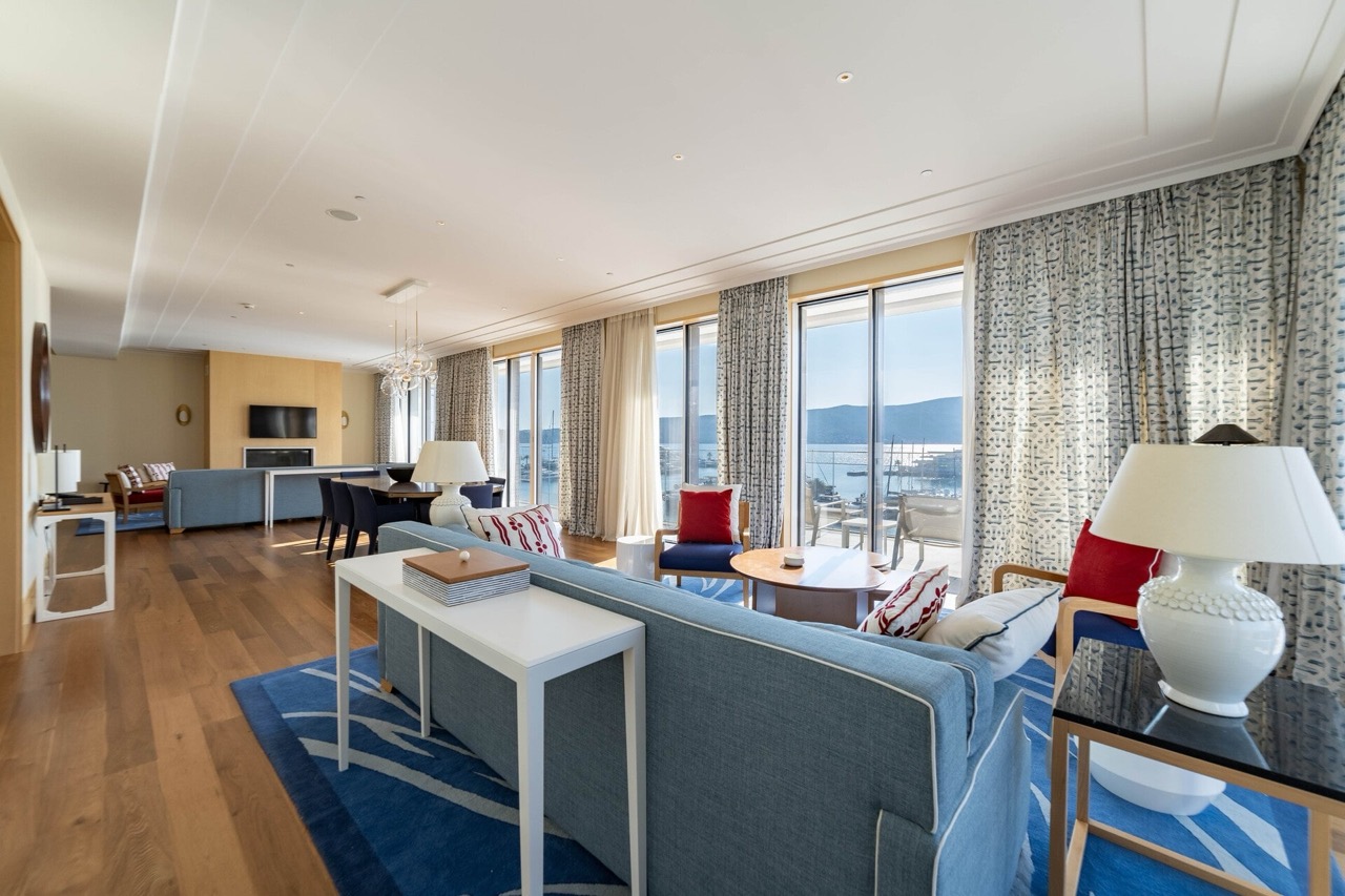 Spacious living room with marina views in a luxury apartment, Tivat, Montenegro: modern furniture and panoramic windows.
