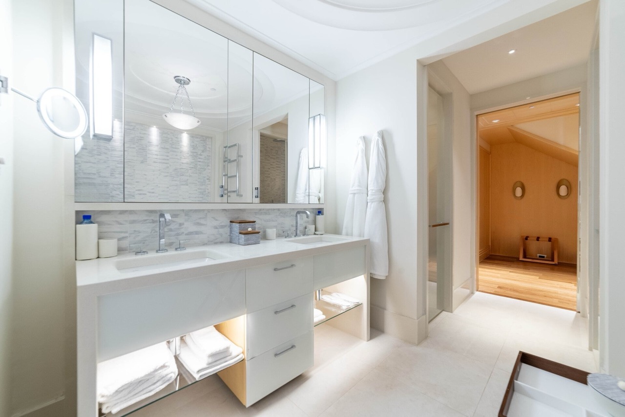 Modern bathroom with two sinks in a luxury apartment, Tivat, Montenegro: marble finishes and lighting.
