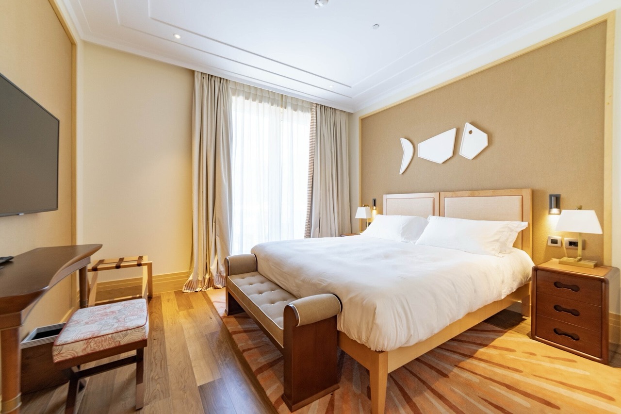 Bright bedroom with a double bed and designer decor in an apartment, Tivat, Montenegro.