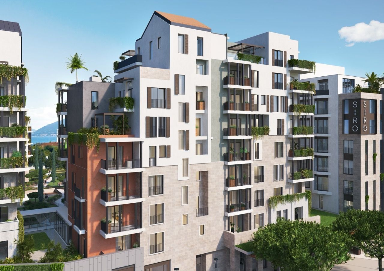 Modern residential complex Siro in Porto Montenegro, Tivat, Montenegro: view of the building facades with terraces and greenery.