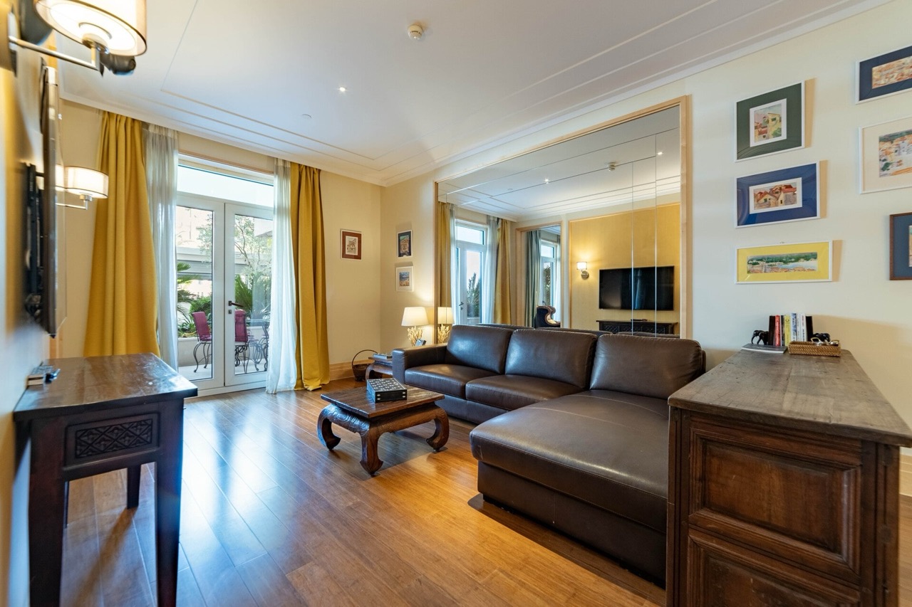 Living room with a leather sofa and terrace in the Porto Montenegro apartments, Tivat, Montenegro.