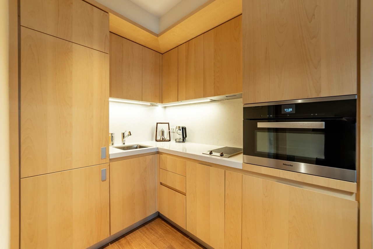 Modern light wood kitchen with Miele appliances in an apartment in Porto Montenegro, Tivat, Montenegro.
