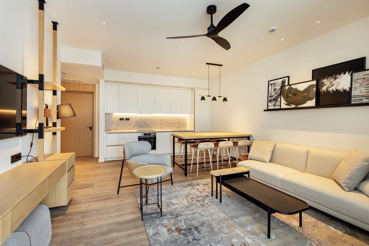 Modern living room with kitchen in Porto Montenegro apartments, Tivat, Montenegro: stylish furniture and bright interior.