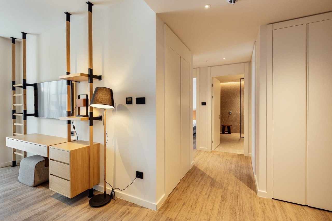 Modern bedroom interior with wooden furniture in Porto Montenegro apartments, Tivat, Montenegro.