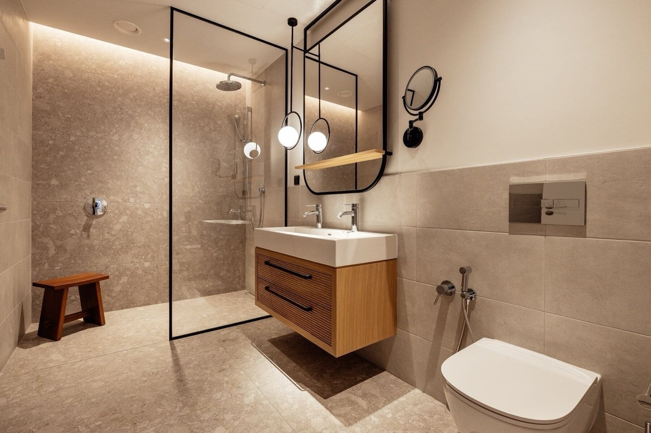 Modern bathroom in an apartment in Porto Montenegro, Tivat, Montenegro: shower, wooden vanity, and stylish decor.