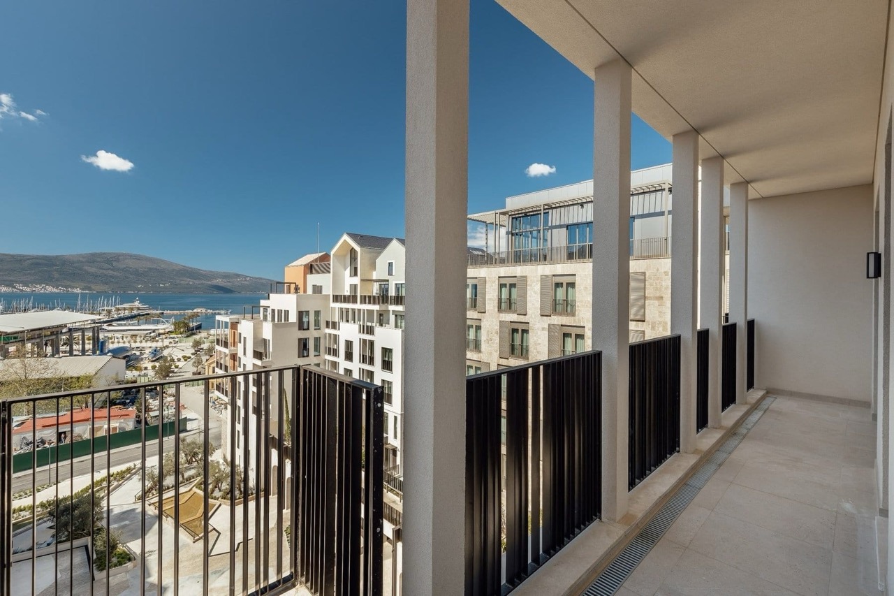 Spacious balcony with views of the marina and mountains in the luxury Porto Montenegro residential complex, Tivat, Montenegro.