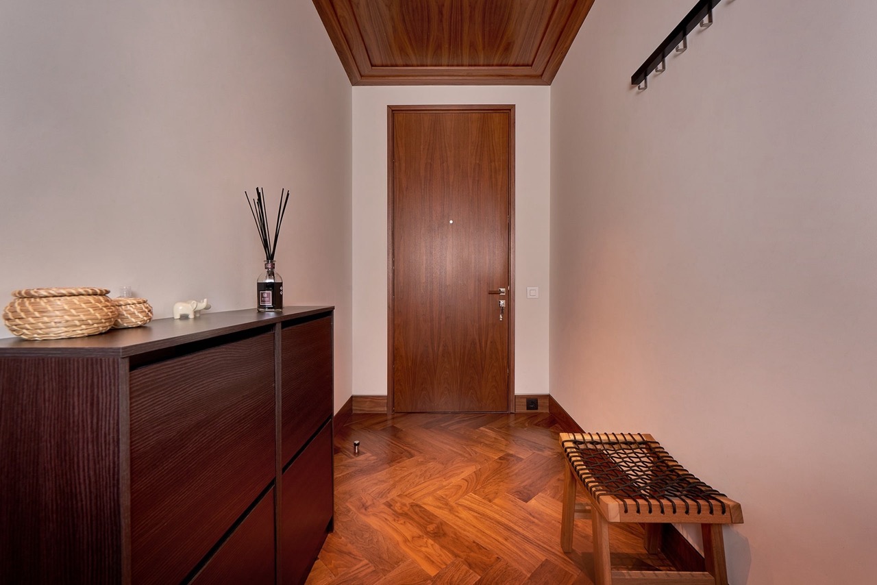 Modern hallway with herringbone wood flooring in an apartment in Porto Montenegro, Tivat, Montenegro.