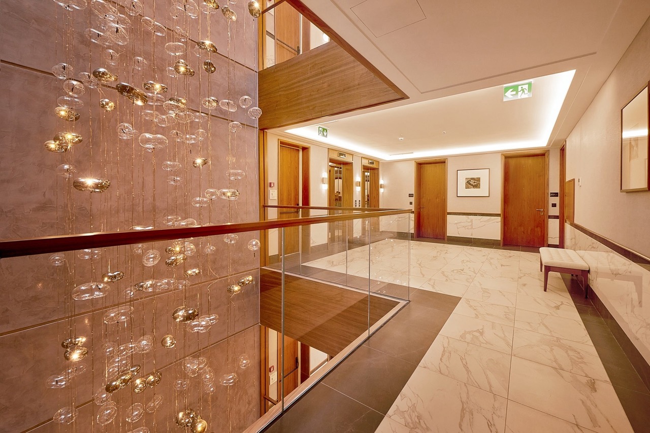 Luxurious lobby with a designer chandelier and marble floor in the upscale Porto Montenegro residential complex, Tivat, Montenegro