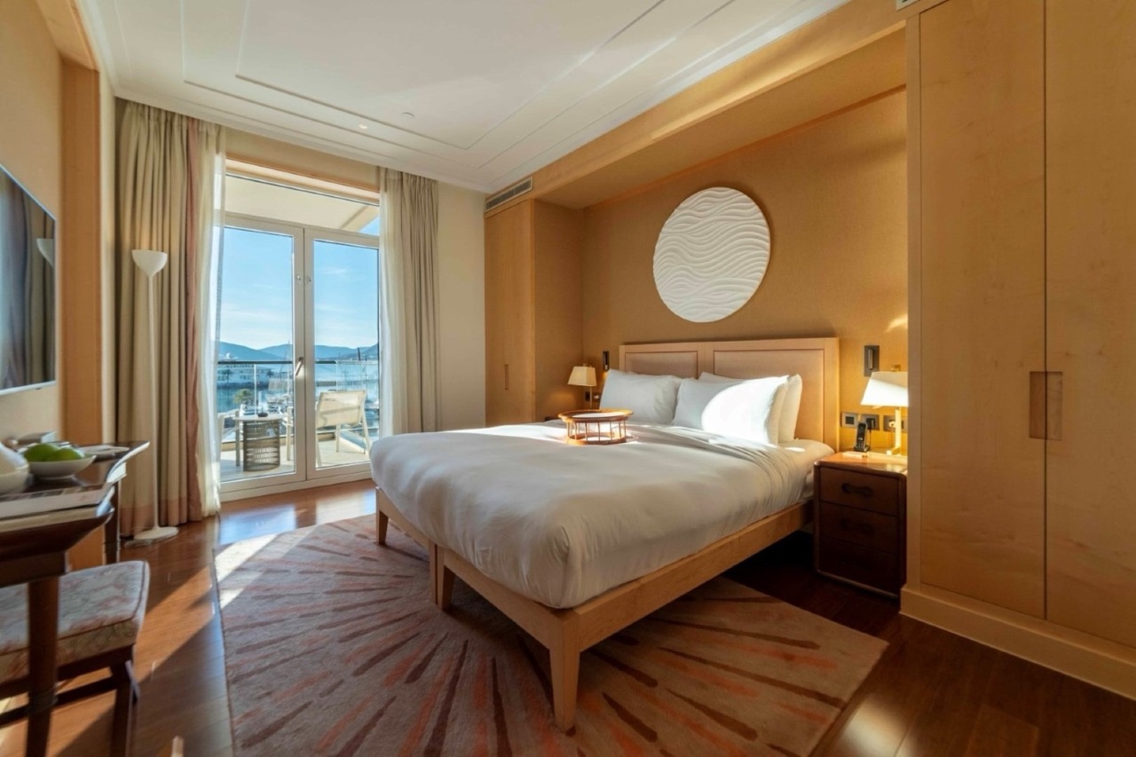 Bedroom in Porto Montenegro apartments, Tivat, Montenegro: double bed, marina view, and terrace.