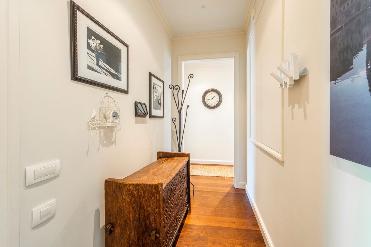 Bright hallway with wooden furniture and decor in an apartment in Porto Montenegro, Tivat, Montenegro.