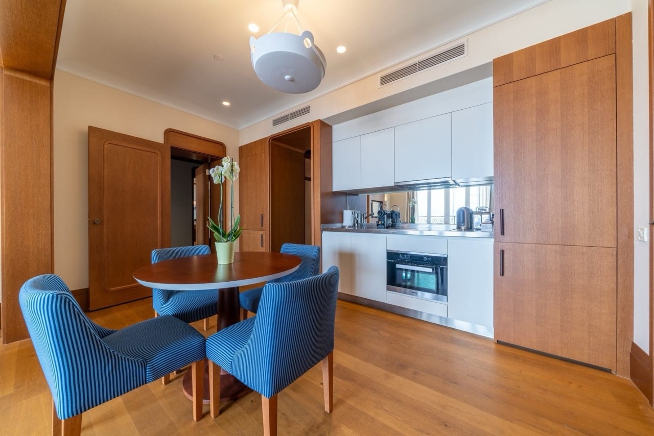 Modern kitchen with dining area in an apartment in Porto Montenegro, Tivat, Montenegro: stylish interior and furniture.