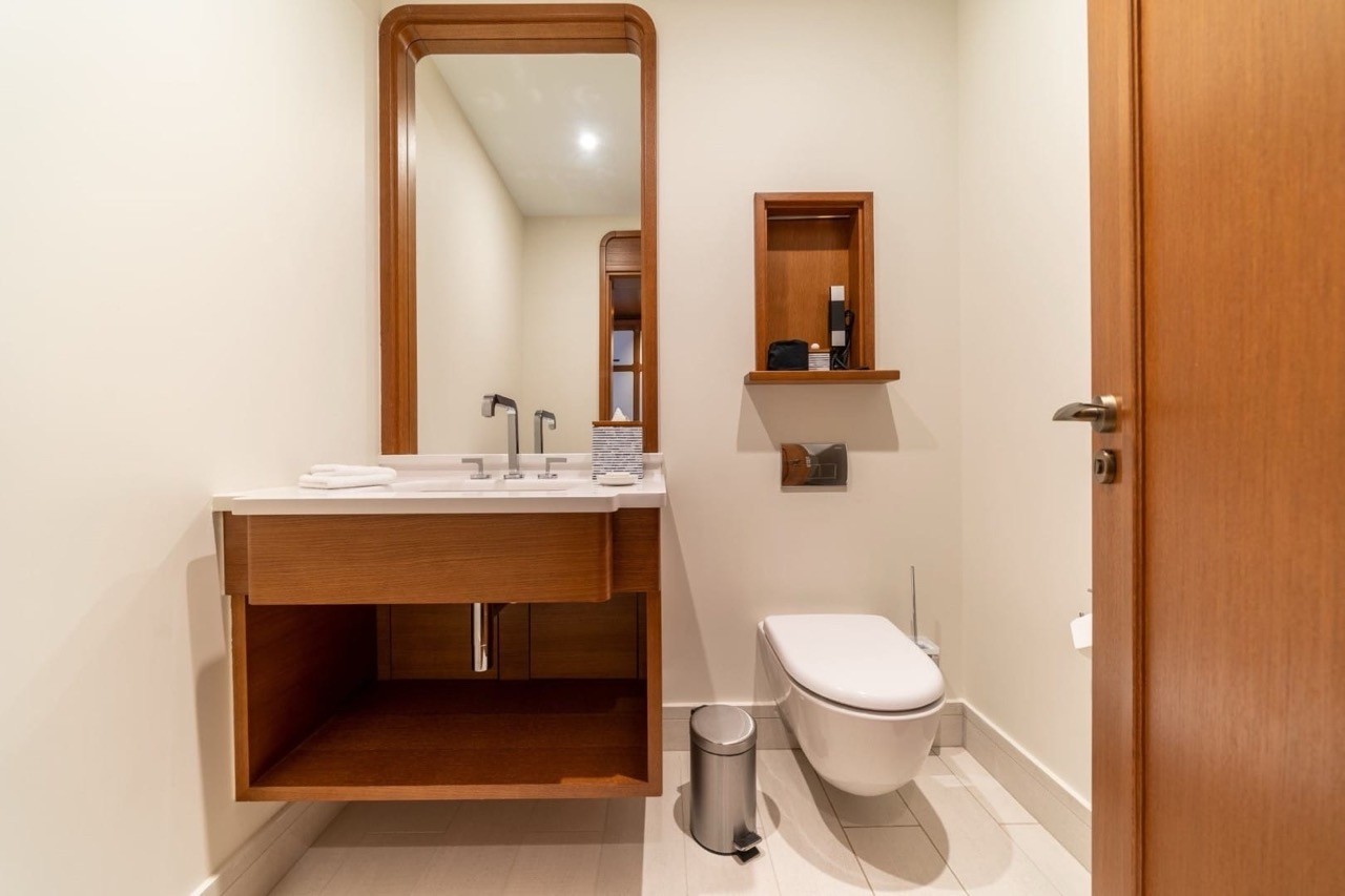Modern bathroom with wooden furniture in an apartment in Porto Montenegro, Tivat, Montenegro.