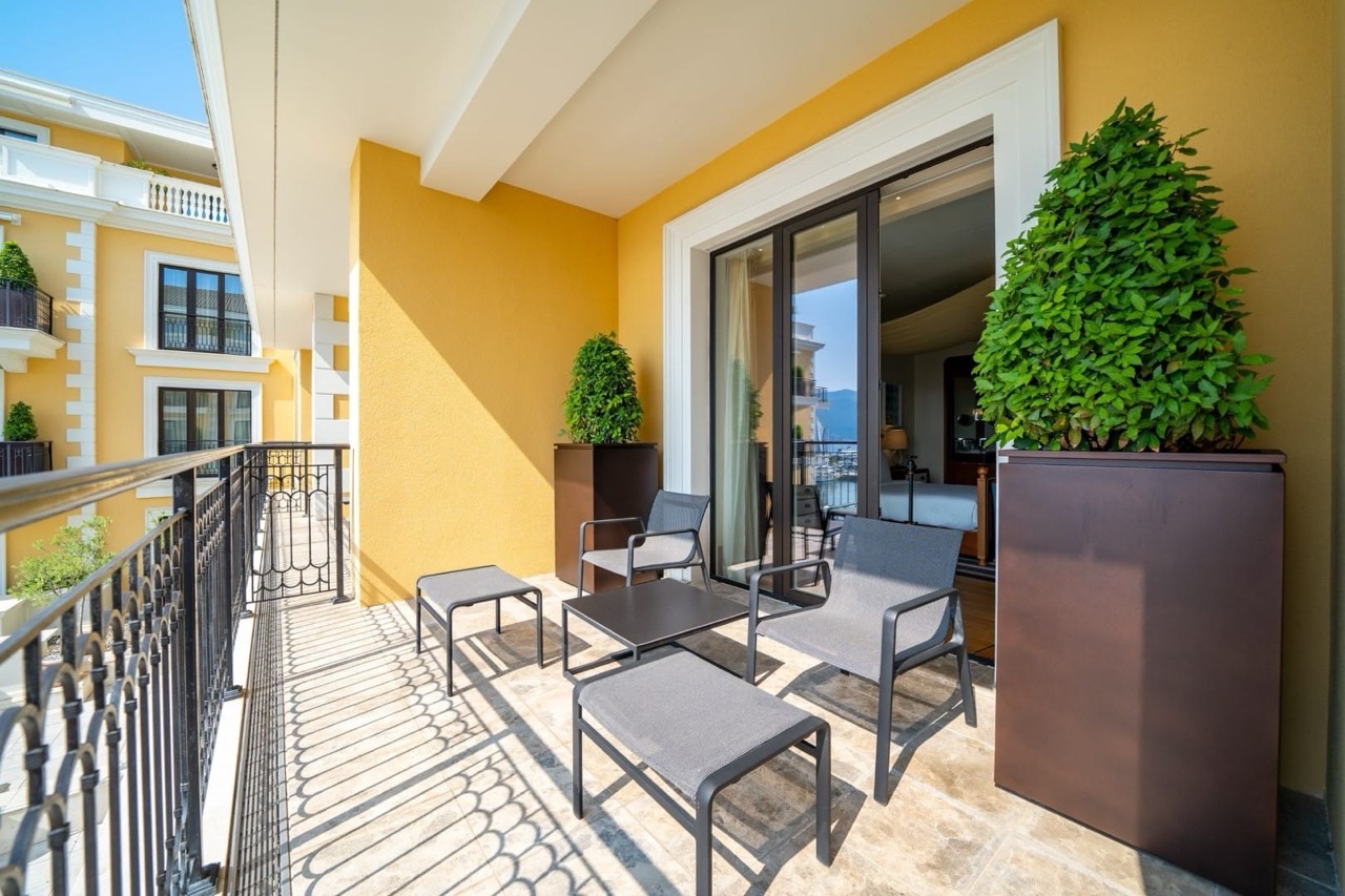 Cozy balcony with furniture in Porto Montenegro apartments, Tivat, Montenegro: marina view and modern finishes.
