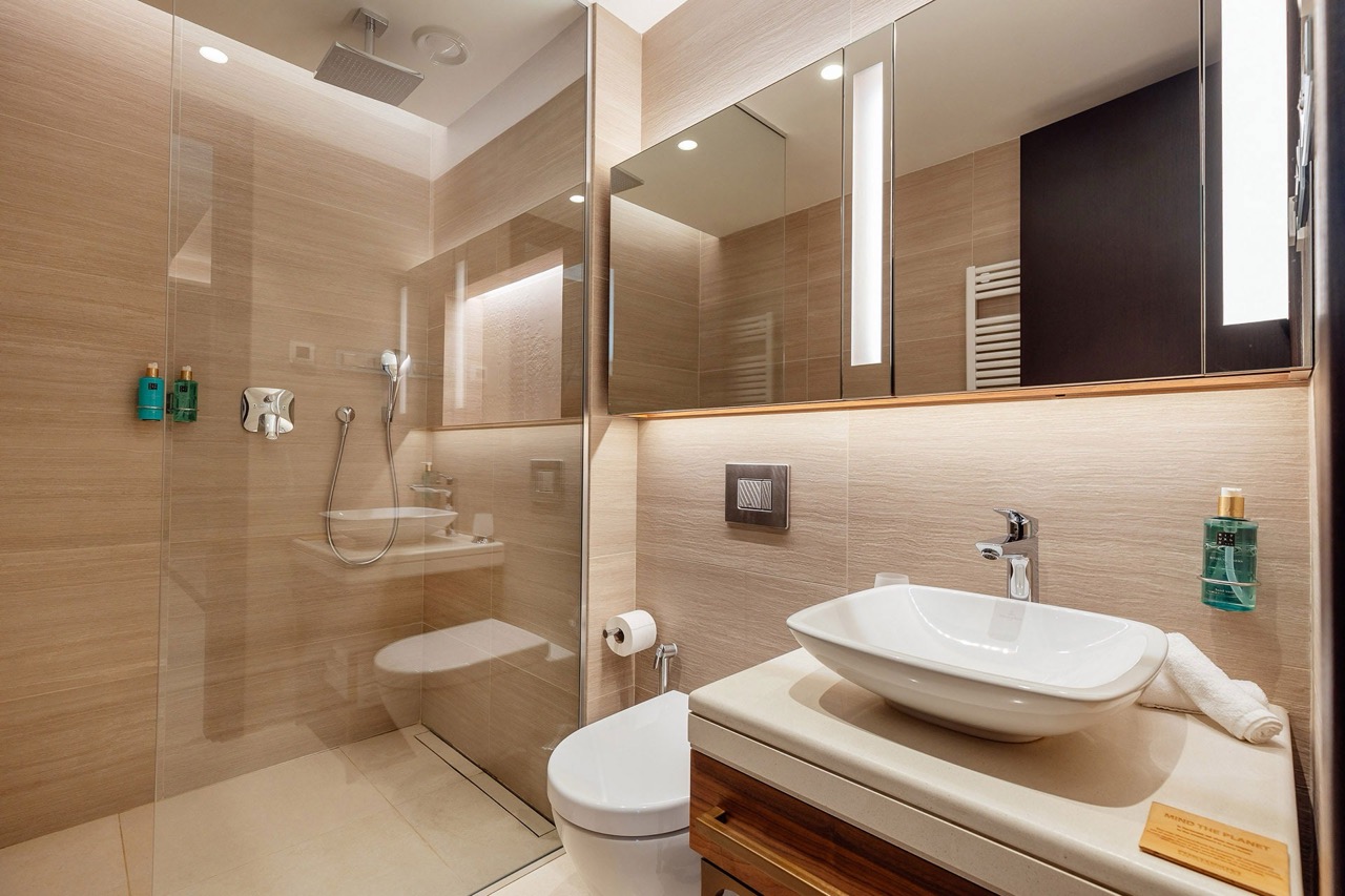 Modern bathroom with a shower cabin in the Portonovi apartments, Kumbor, Montenegro: stylish finishes and fixtures.
